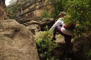 Climbing over a boulder, Drakensberg South Africa